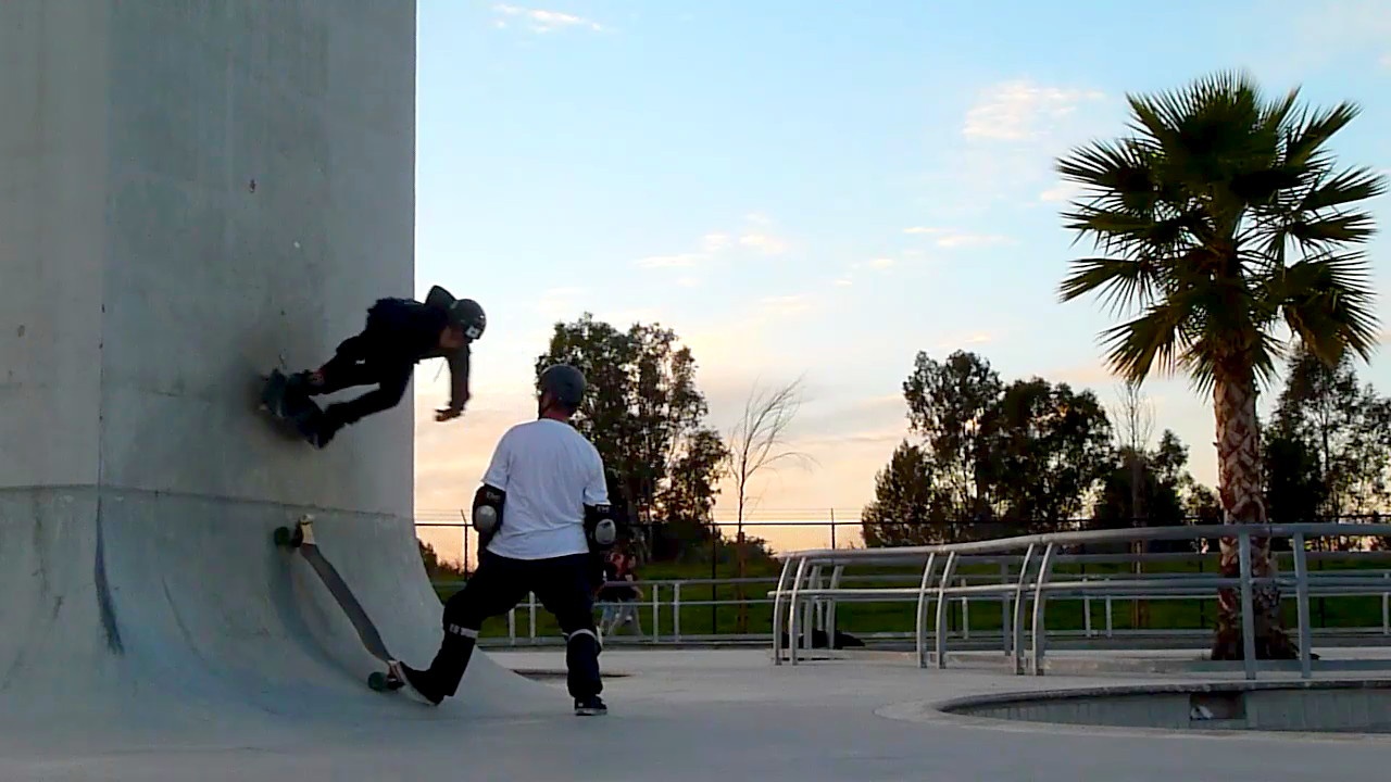 a person wearing protective gear while riding a skateboard