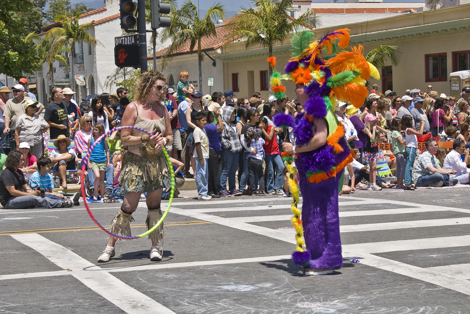 two people in colorful costumes and some people