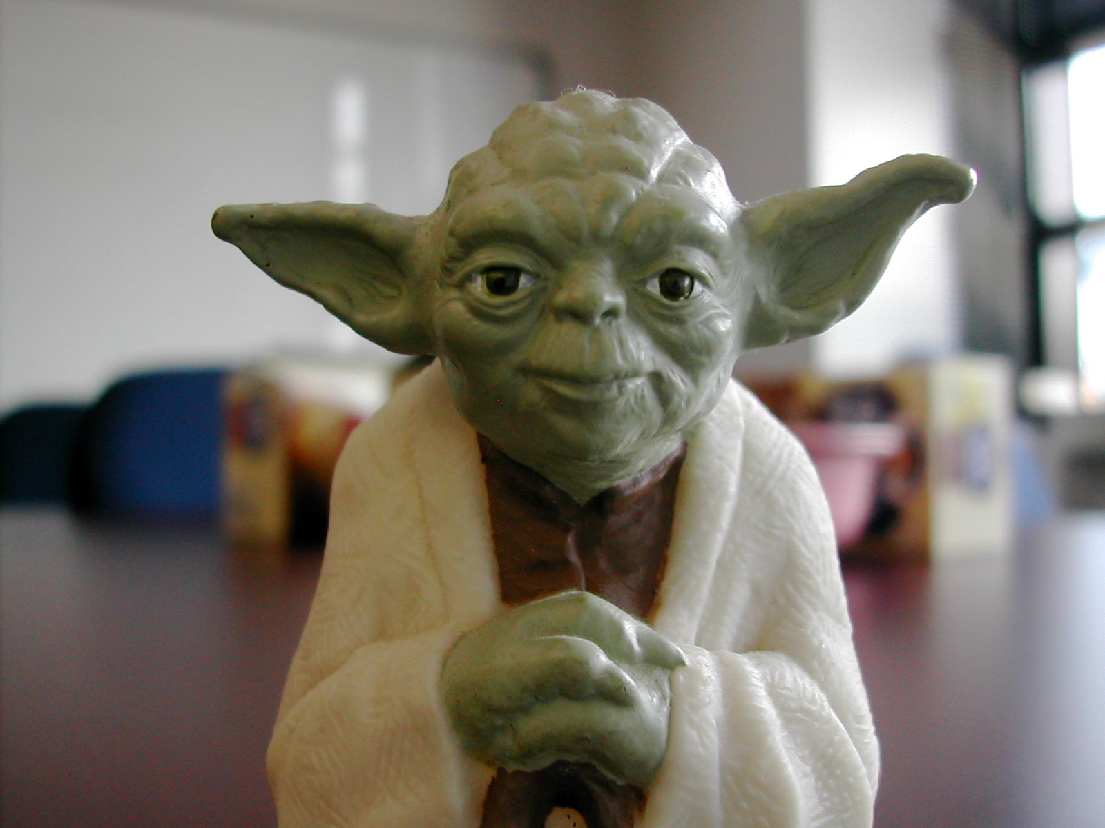 a star wars yoda is sitting on the table
