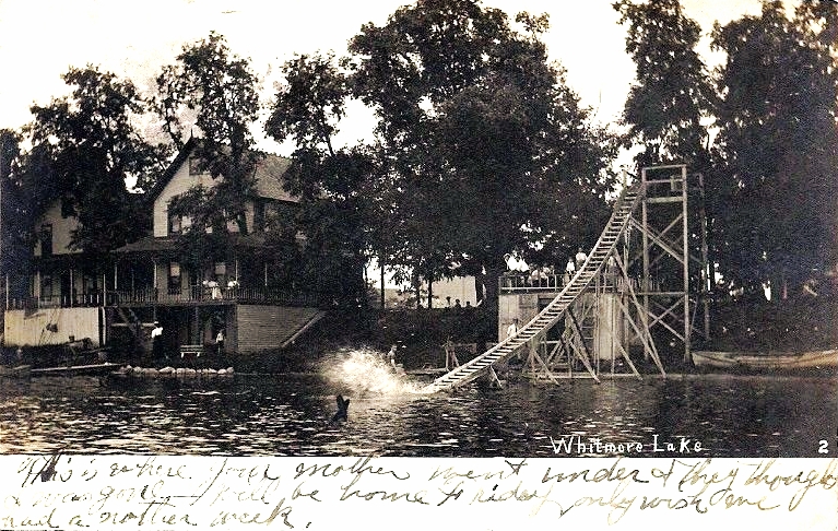 an old picture of a house on the water