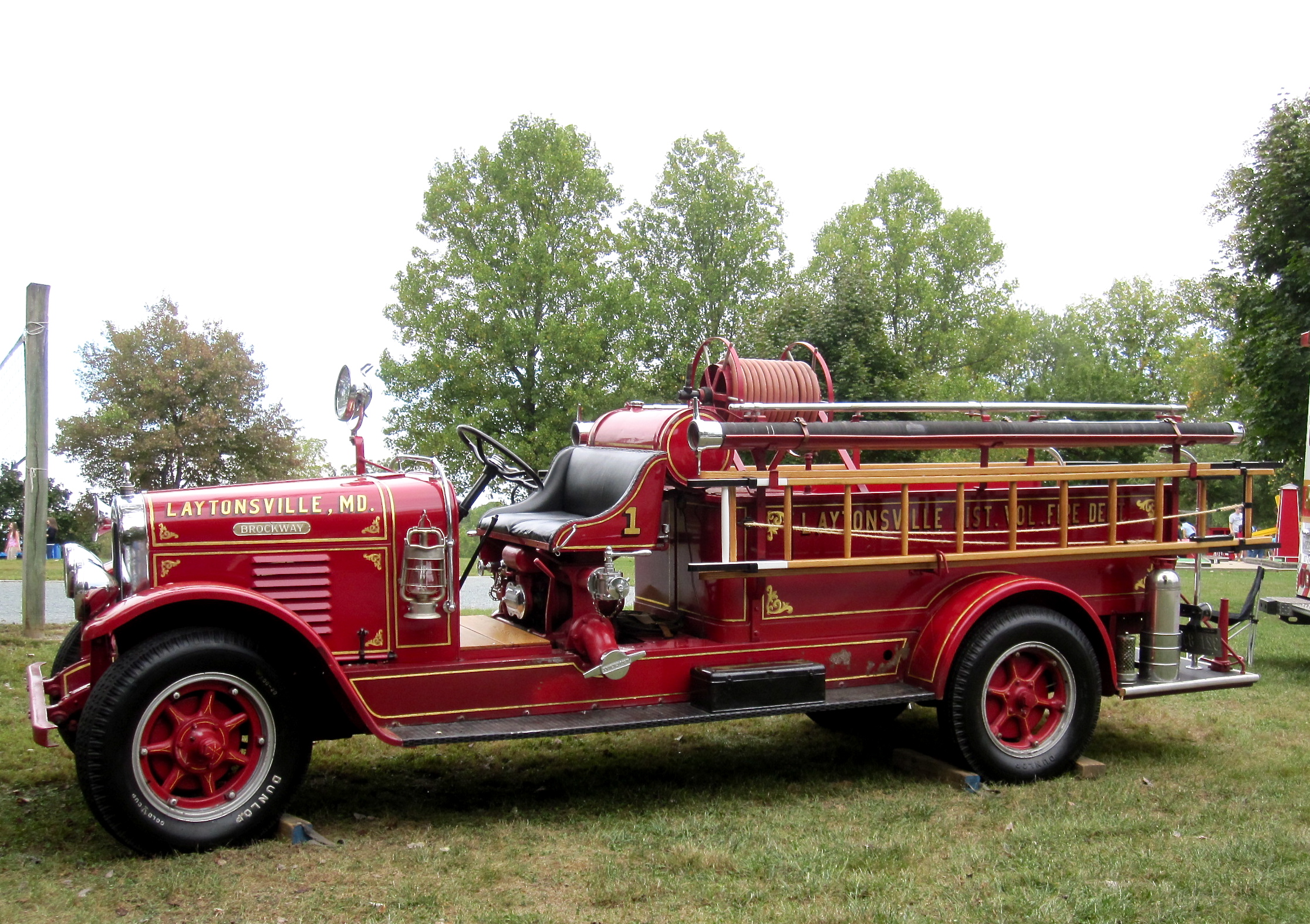 a red fire truck parked in the grass