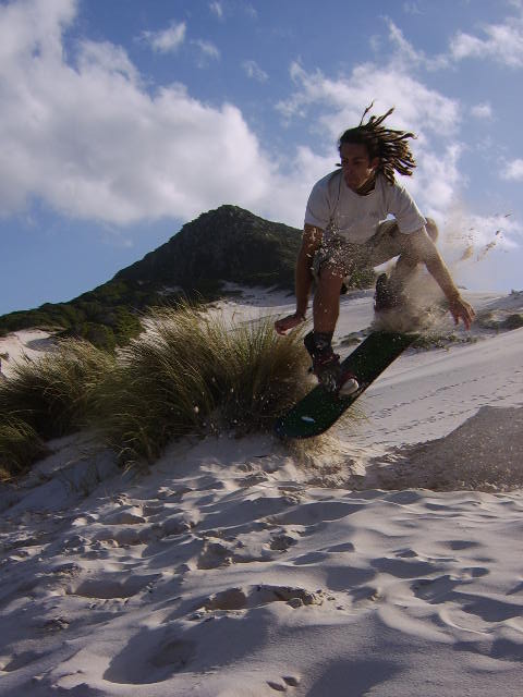 a man is in the air on a skateboard