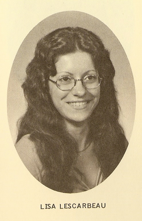 a woman is smiling while wearing glasses
