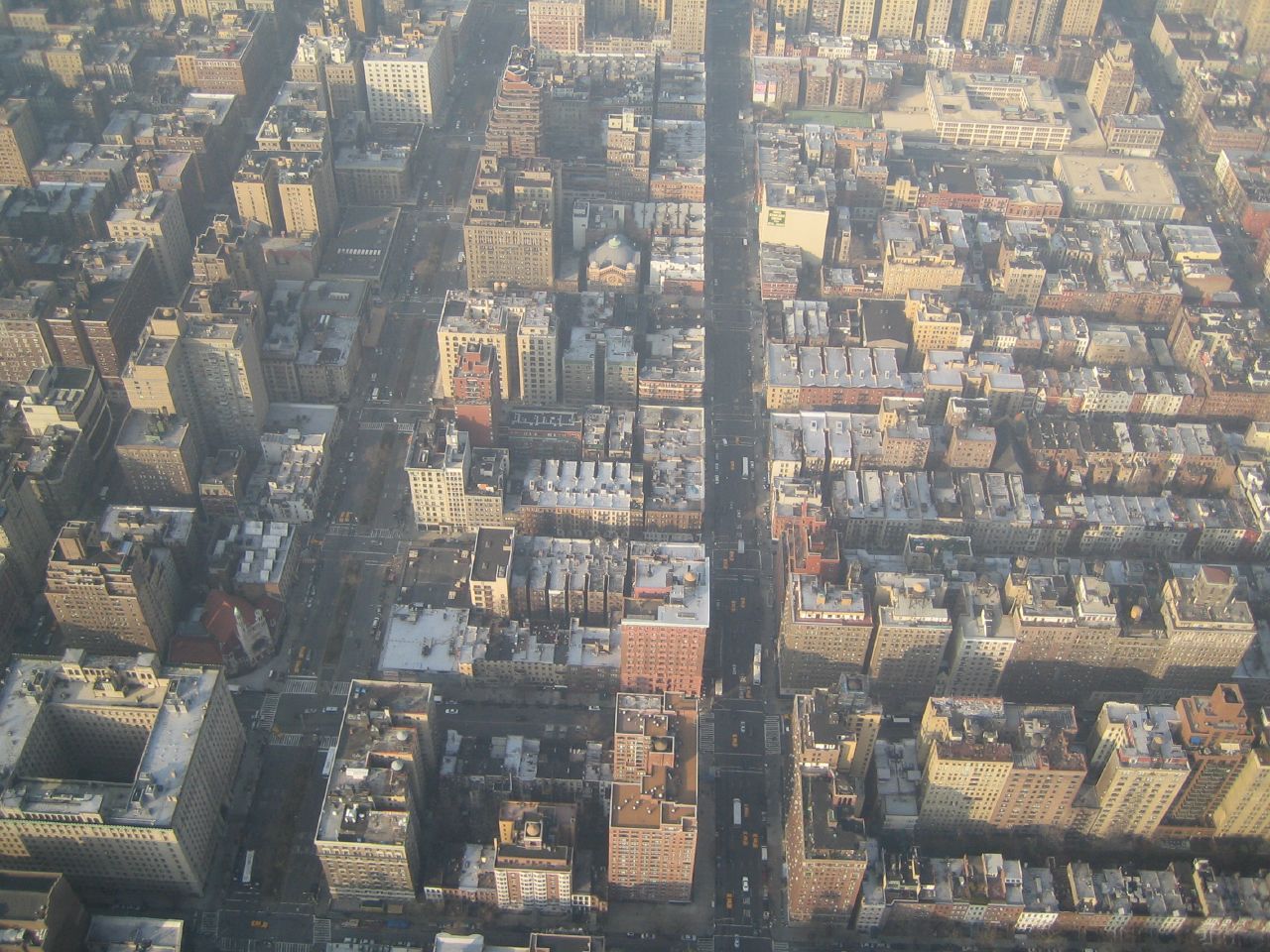 an aerial view of skyscrs in the city