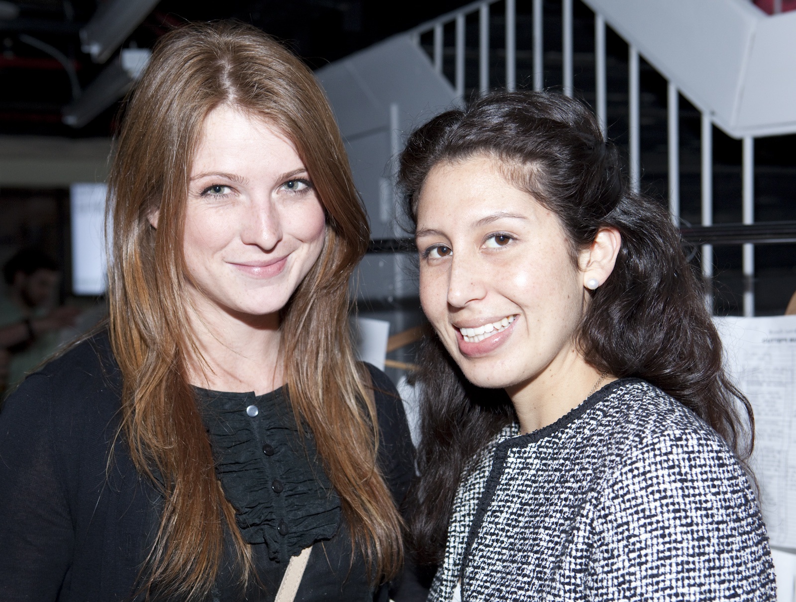 two beautiful women smiling while posing for a picture