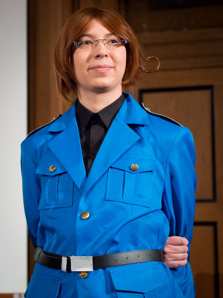 woman in a blue military uniform posing for a po