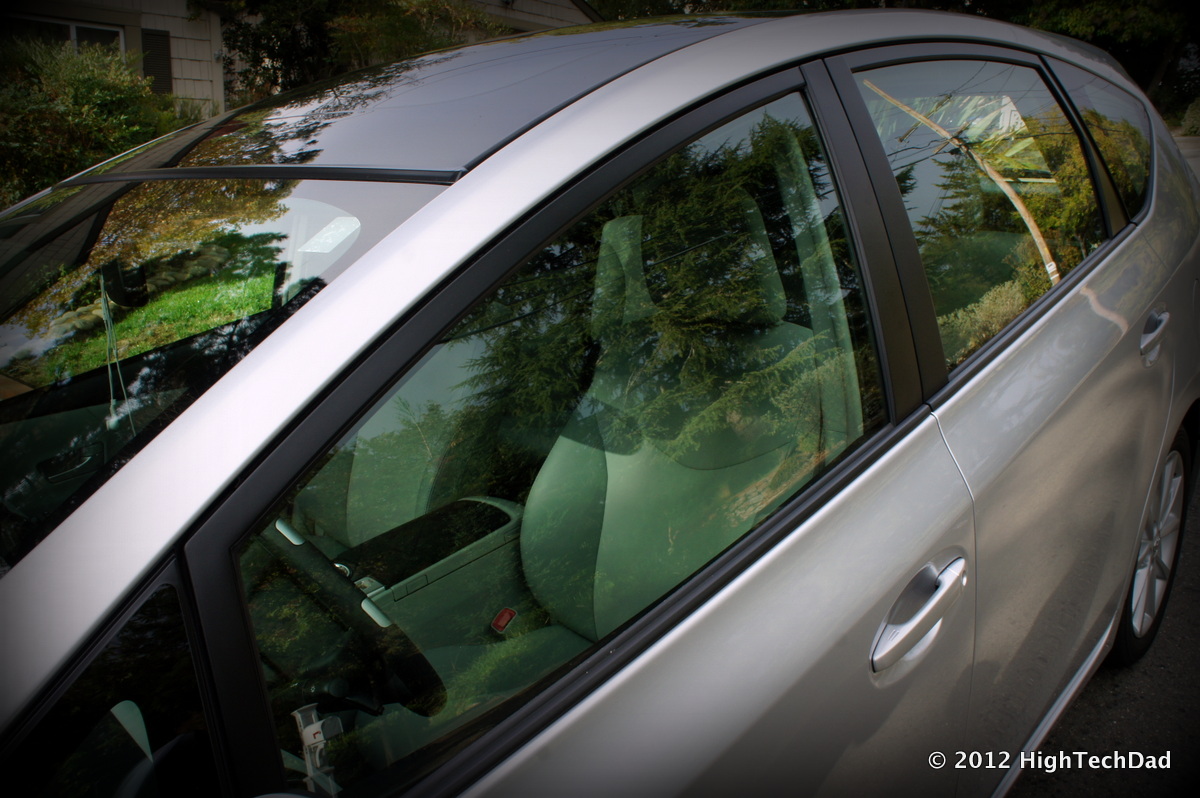 a car that is parked in a lot with trees