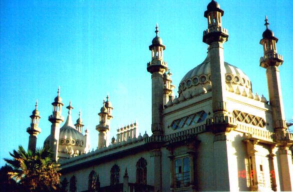 the top of an ornate building with several spires