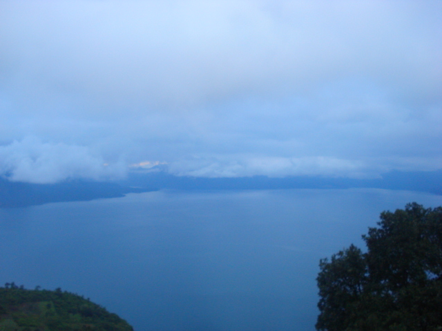 a large body of water sitting on top of a hillside