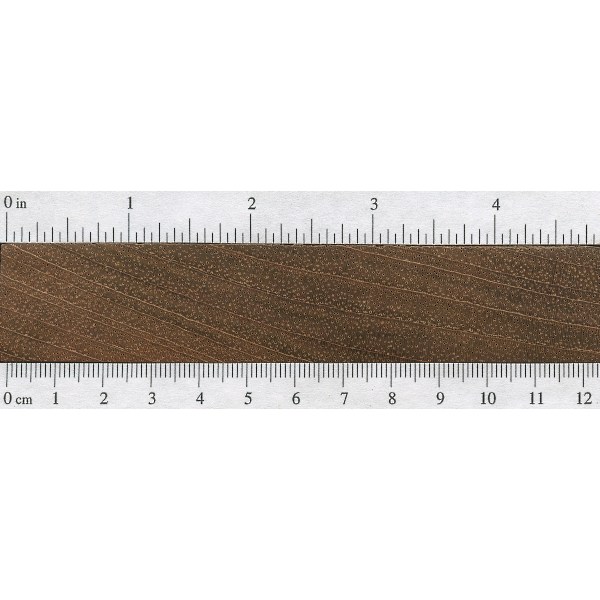 a long ruler is on top of some wood
