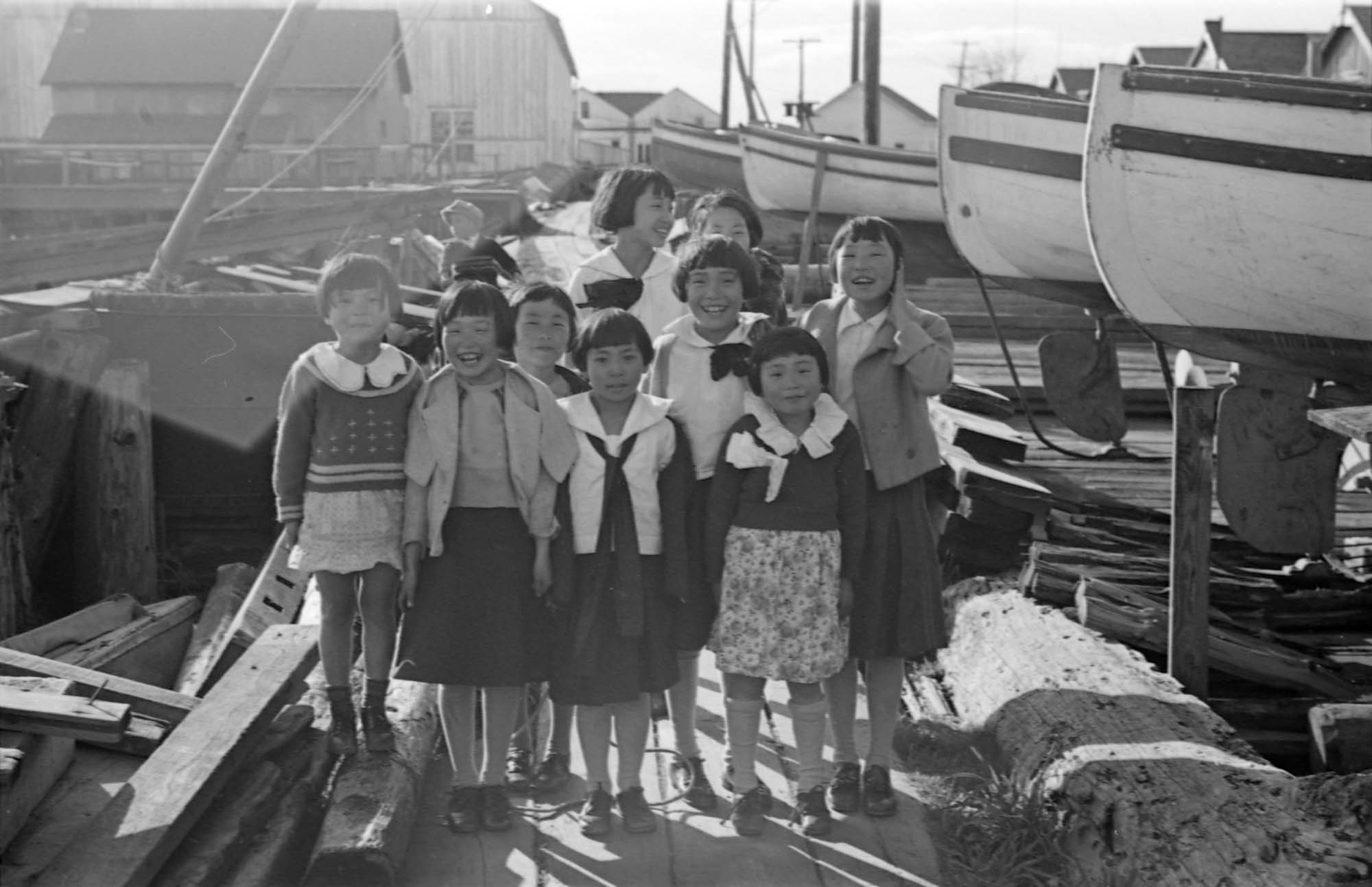 group of girls in sweaters pose for black and white po