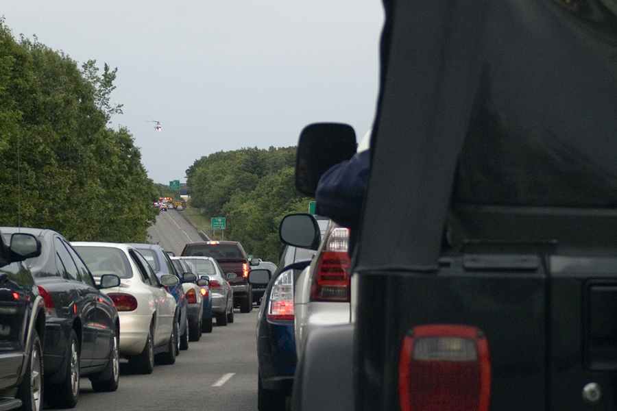 many cars that are lined up on the road