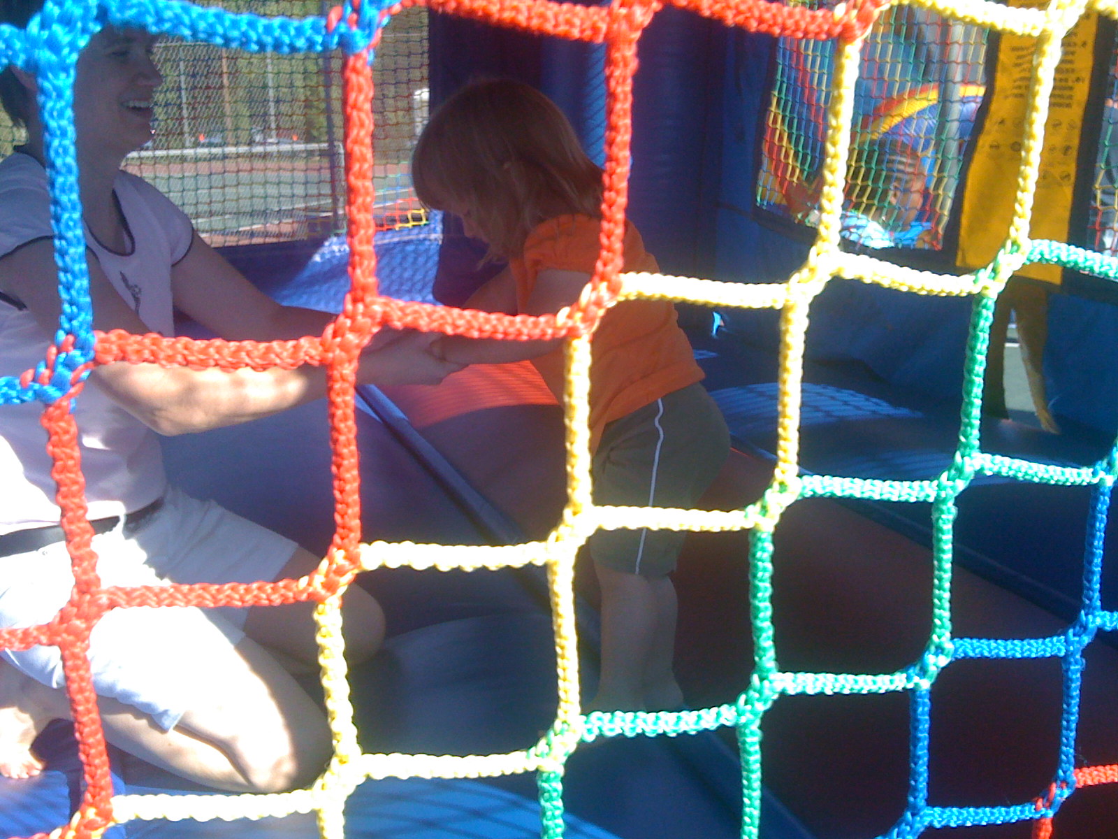 a couple of s inside of a playground net