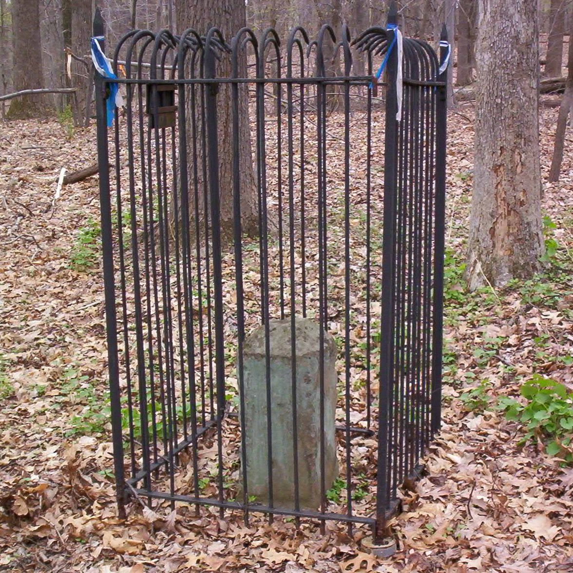 a small cemetery with a bunch of large bars
