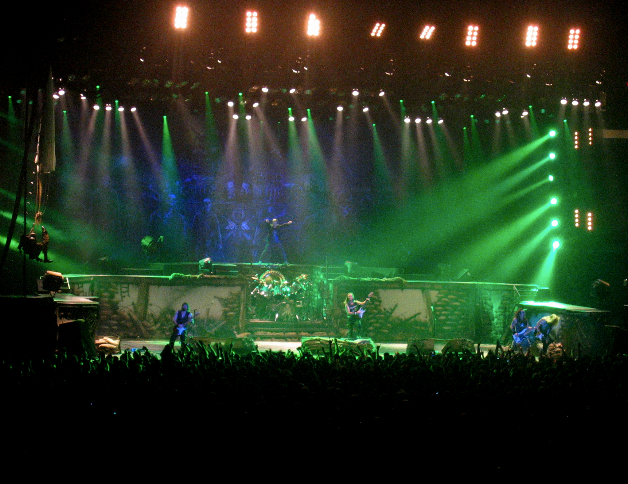 a dark stage with lighting that is green