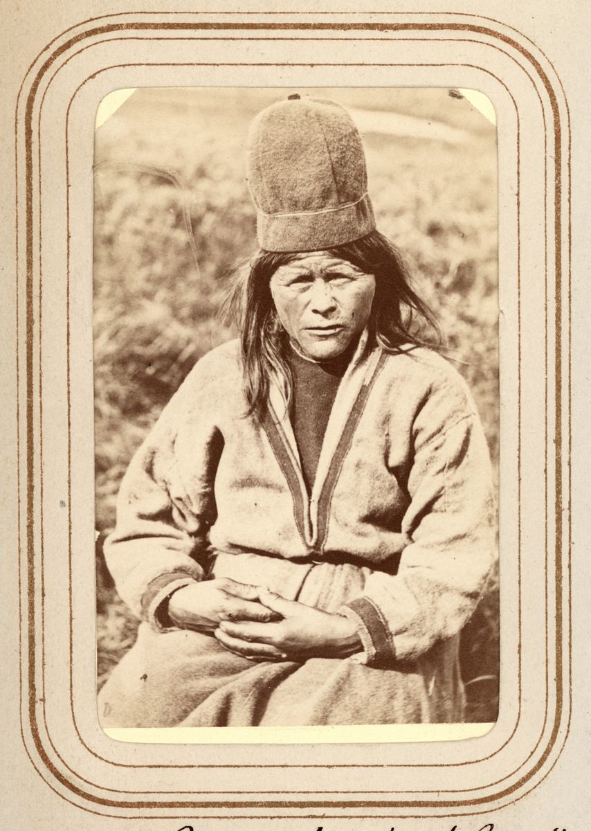 a woman with a hat sitting down