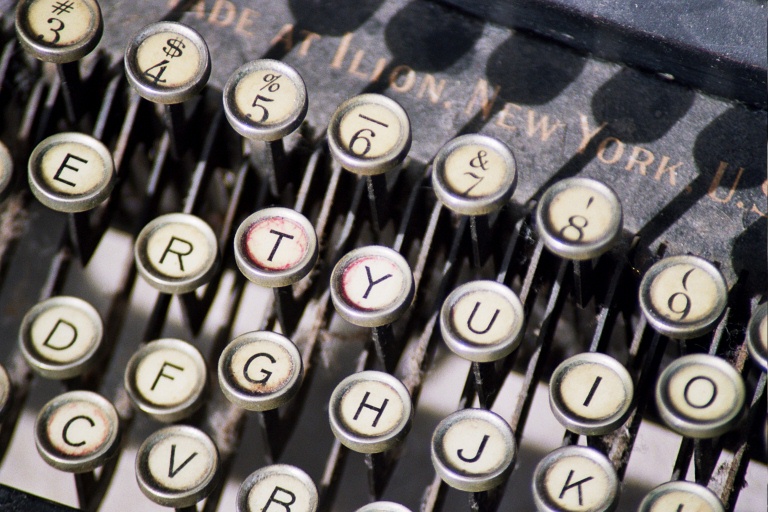 a close up of a typewriter with keys