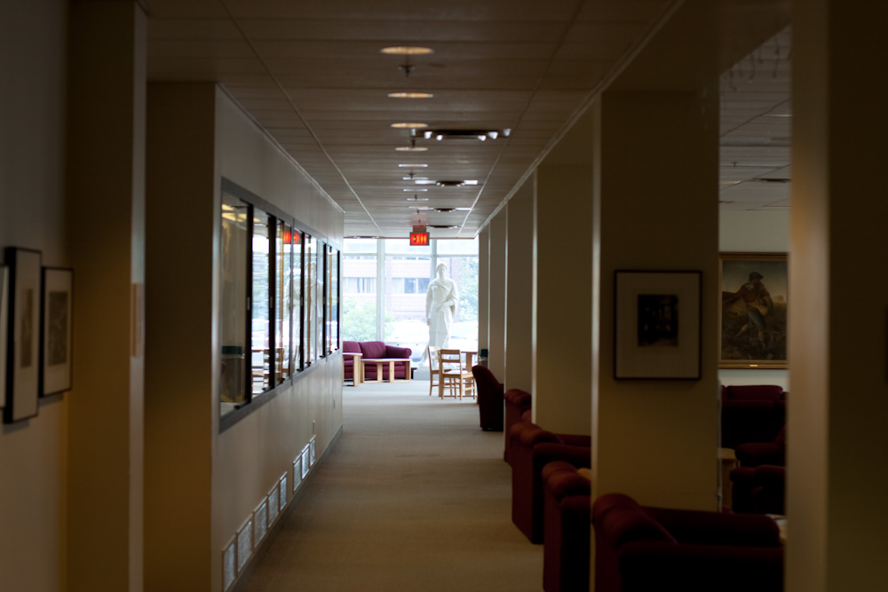 a long hallway that leads to a dining area