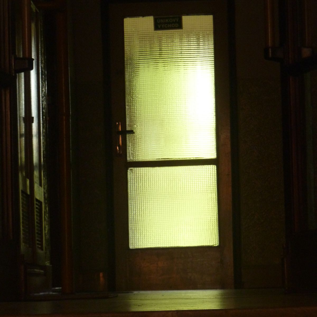 there is a bright yellow light shining in the doorway