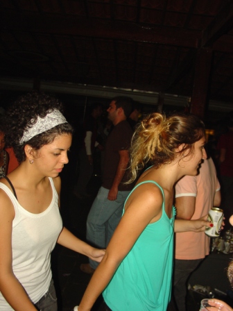 the two girls are dancing together and wearing headbands