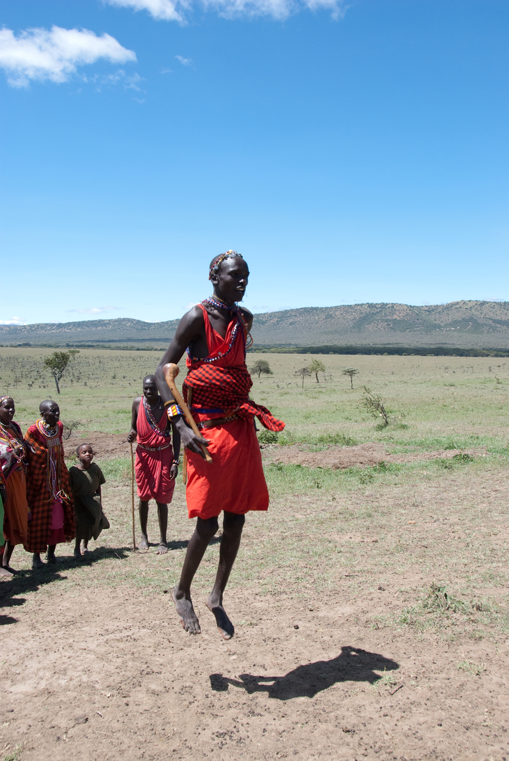 a group of people standing around each other