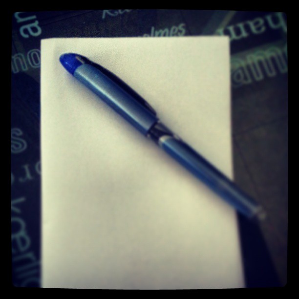 an office fountain pen resting on a piece of paper