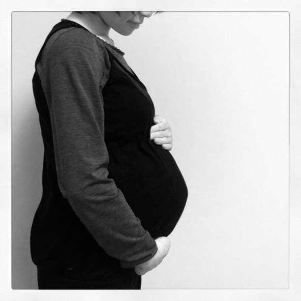a black and white po of a pregnant woman