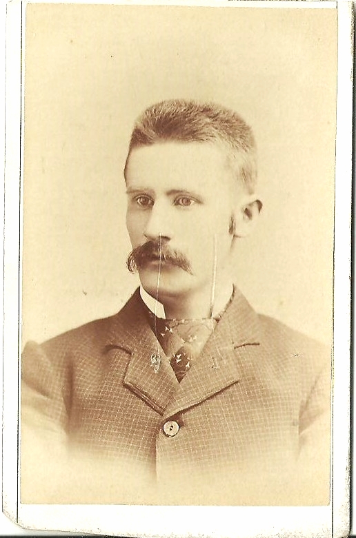 an old po of a man wearing a uniform with moustaches