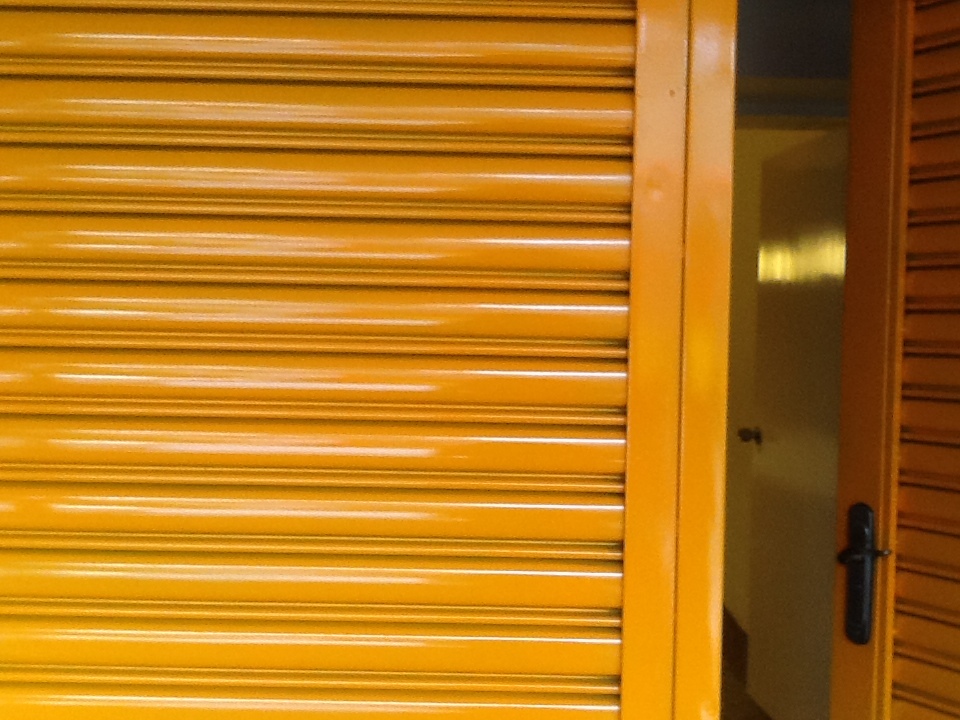 two yellow doors are next to each other