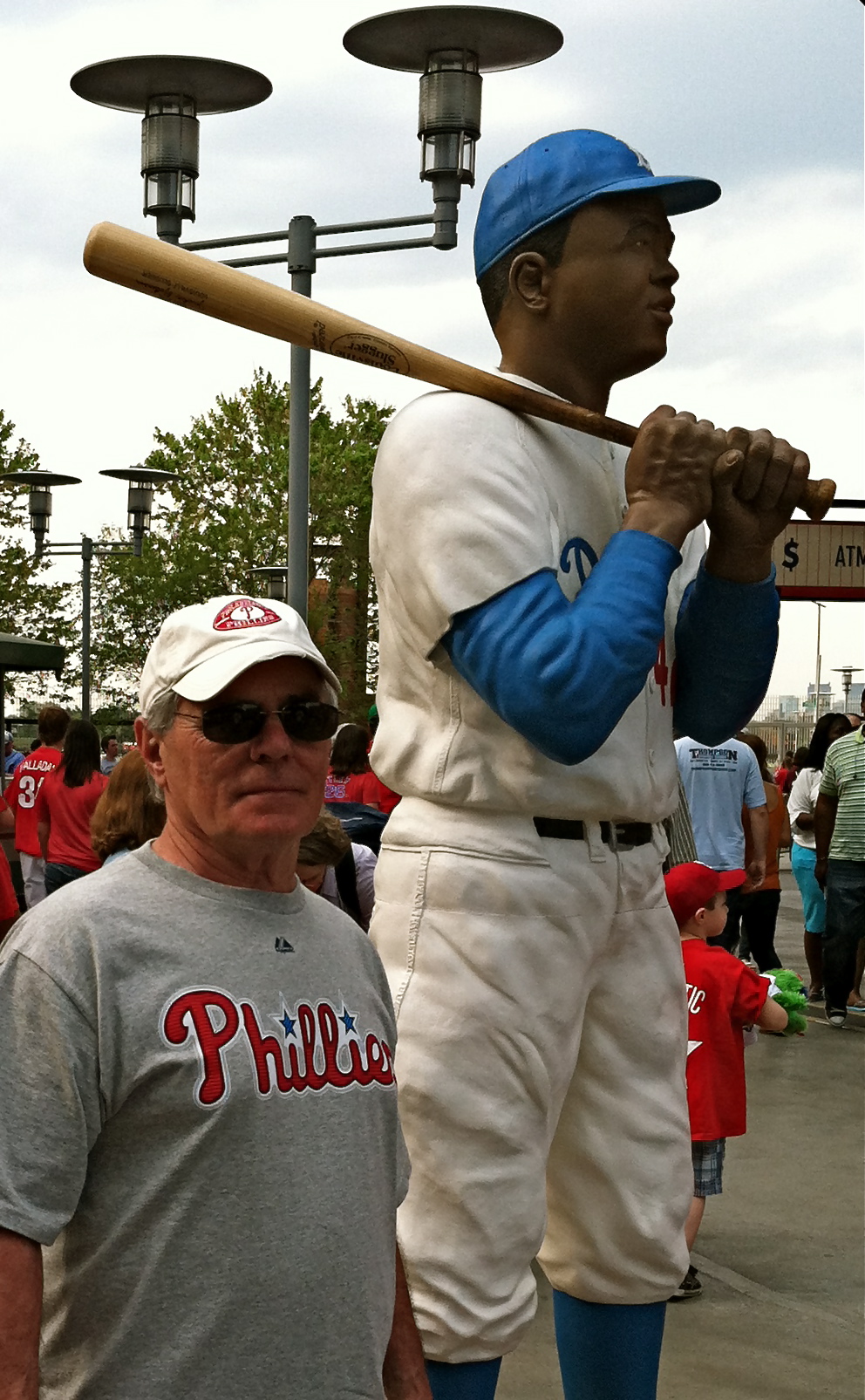 the giant statue of a baseball player in a stadium