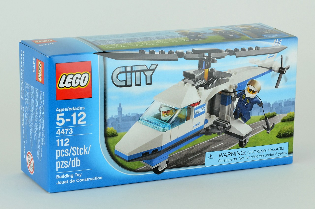 a small toy helicopter is in a boxed package