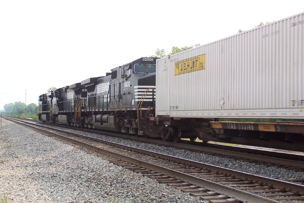 a freight train with multiple boxes on the front of it