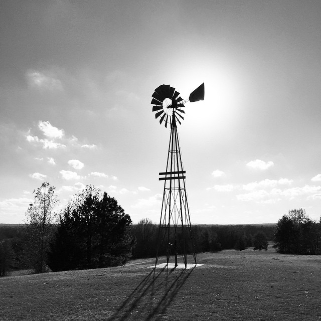 a windmill in the middle of nowhere on a clear day