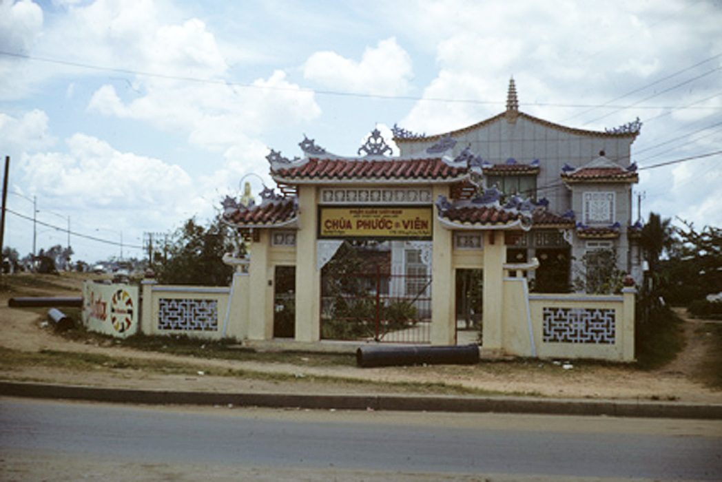 a bus is parked outside a building and gate