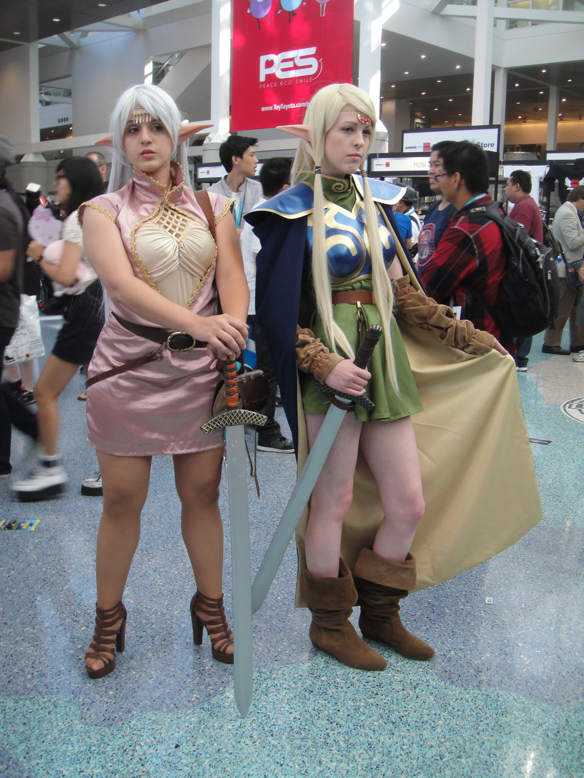 two cosplayed people with a sword and shield