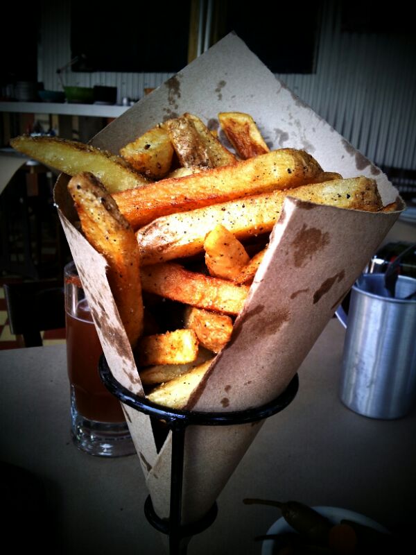 french fries in a basket in a kitchen