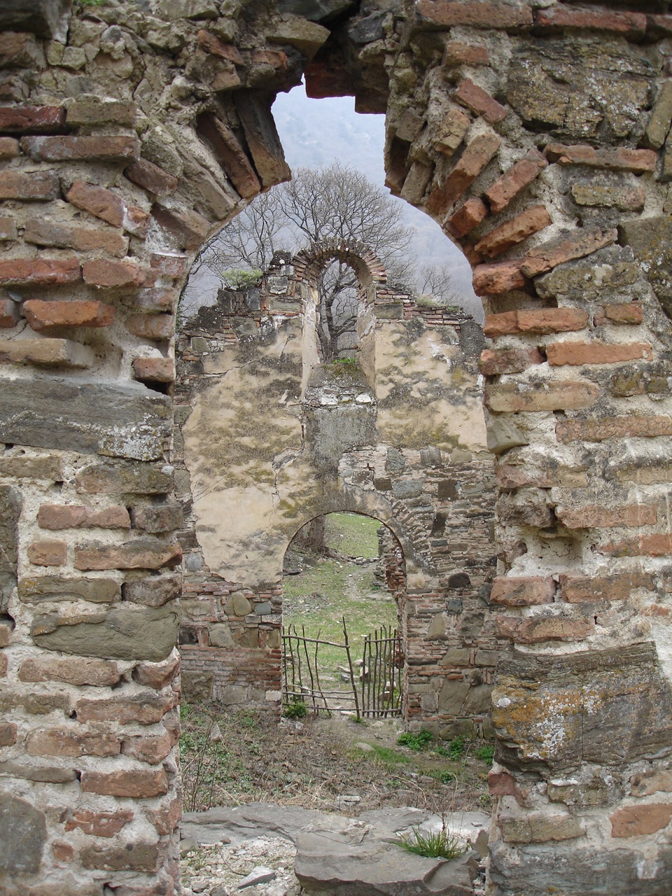 view from between two windows of an ancient ruin