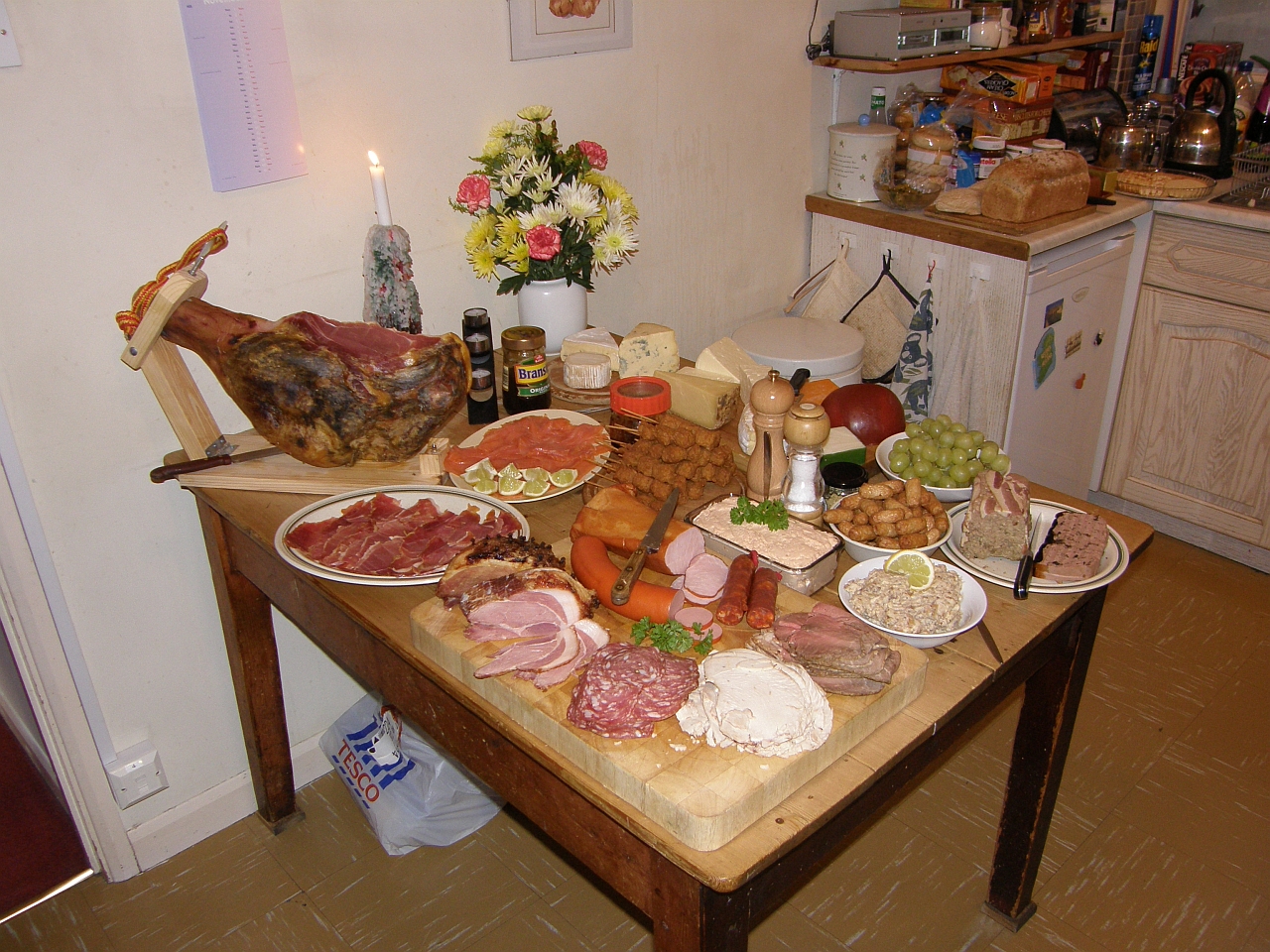 a wooden table topped with lots of different types of food