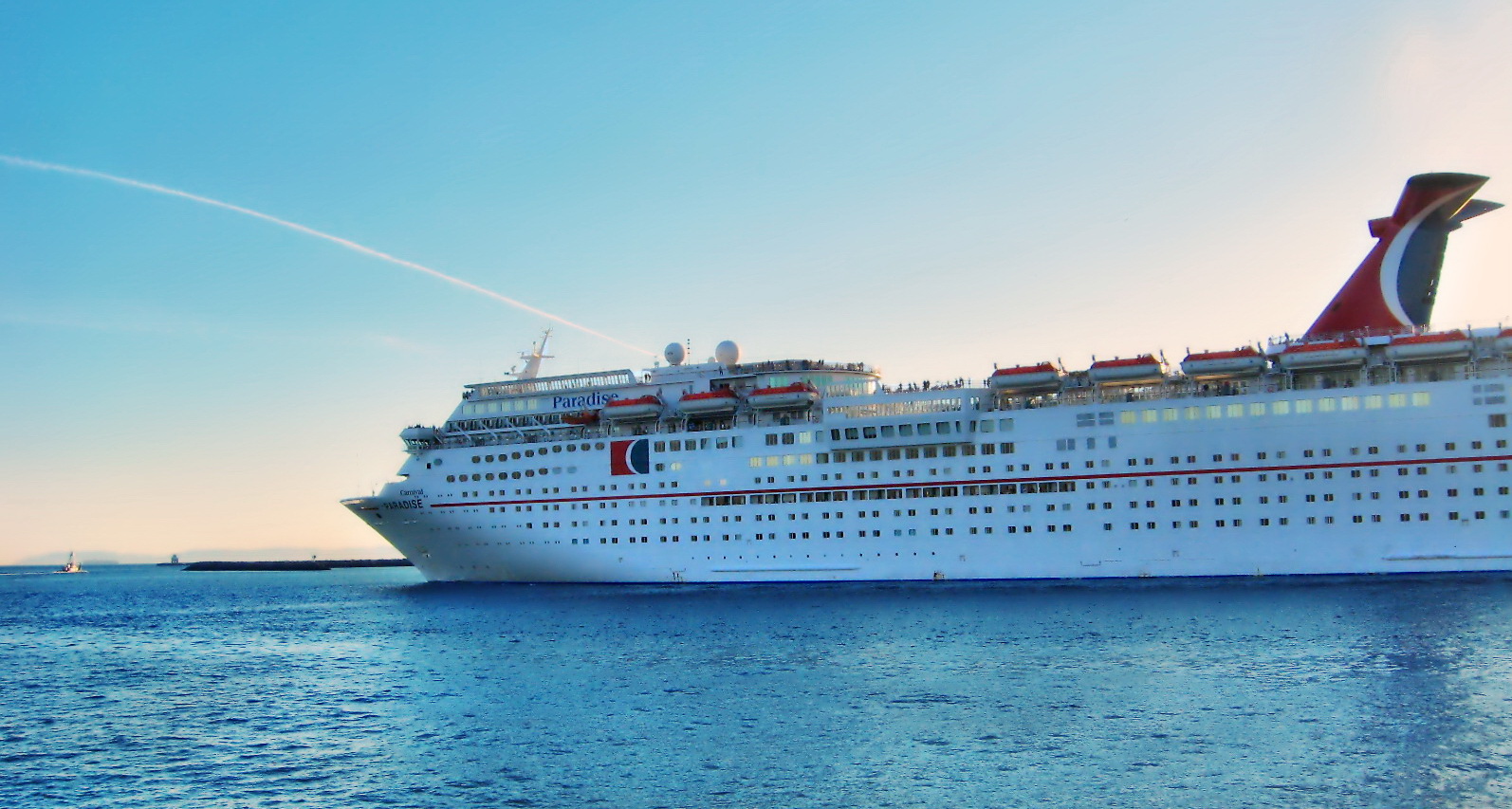 a large white cruise ship sailing through the water