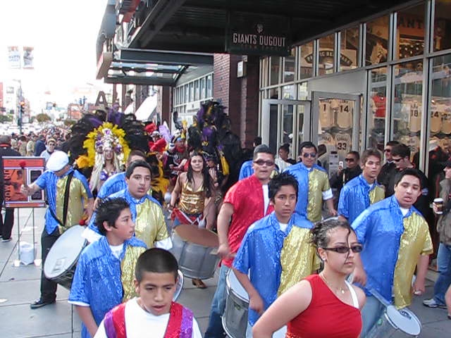 group of people with costumes walking down a street