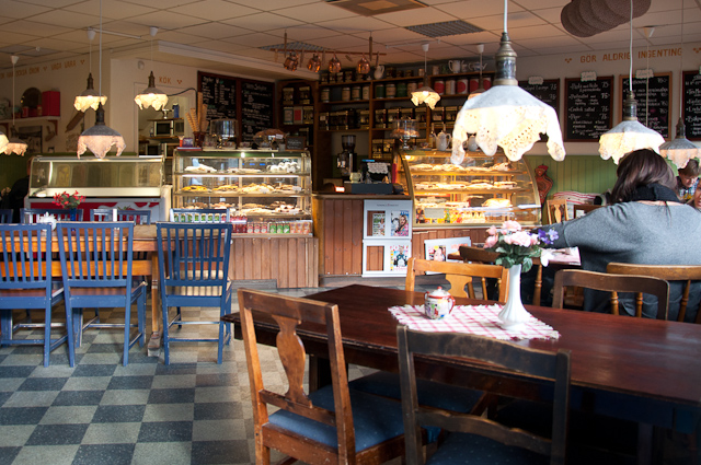 the interior of a bakery with a checkered table
