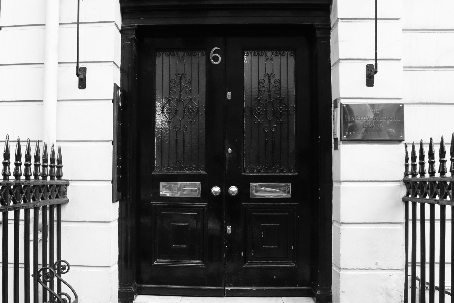 the double doors are painted black and white