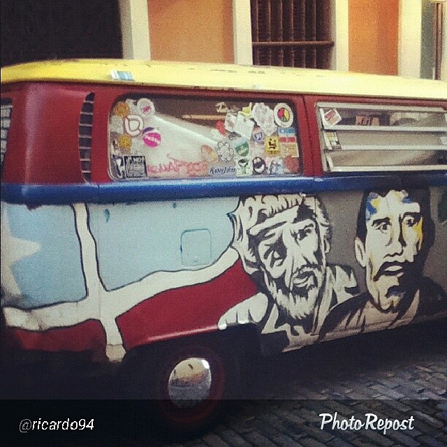 a bus painted with a painting of two men on it