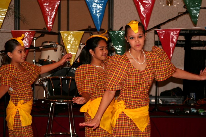 a group of young ladies dance in costumes