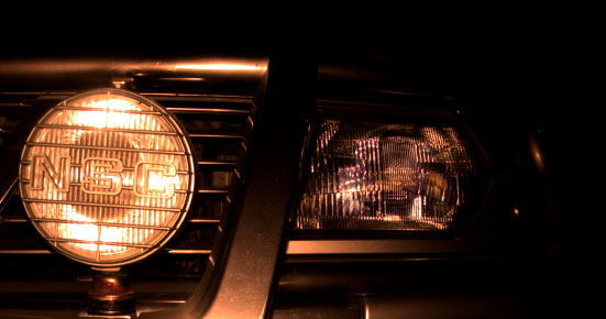 a close up view of the headlight of a car