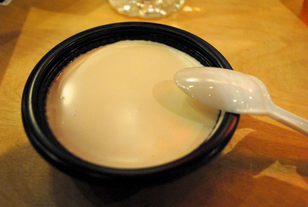 a close up of a spoon on a container