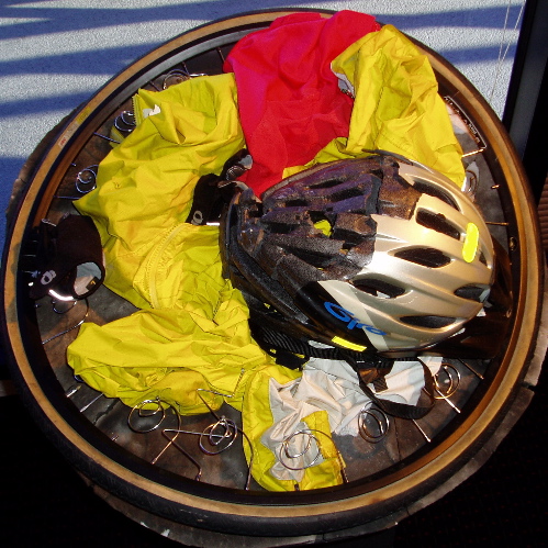 a helmet and other gear sits in a wooden container