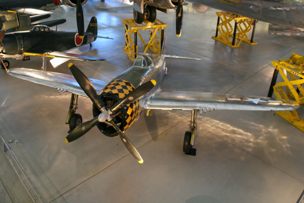 two fighter planes are on display on the floor