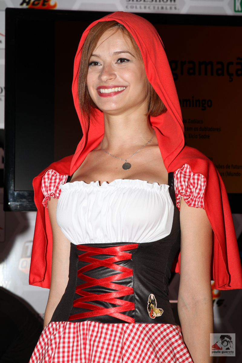 the woman in the costume is smiling at the camera