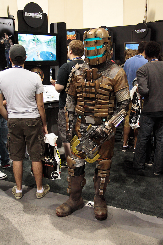 a person in a robot suit with a video game controller